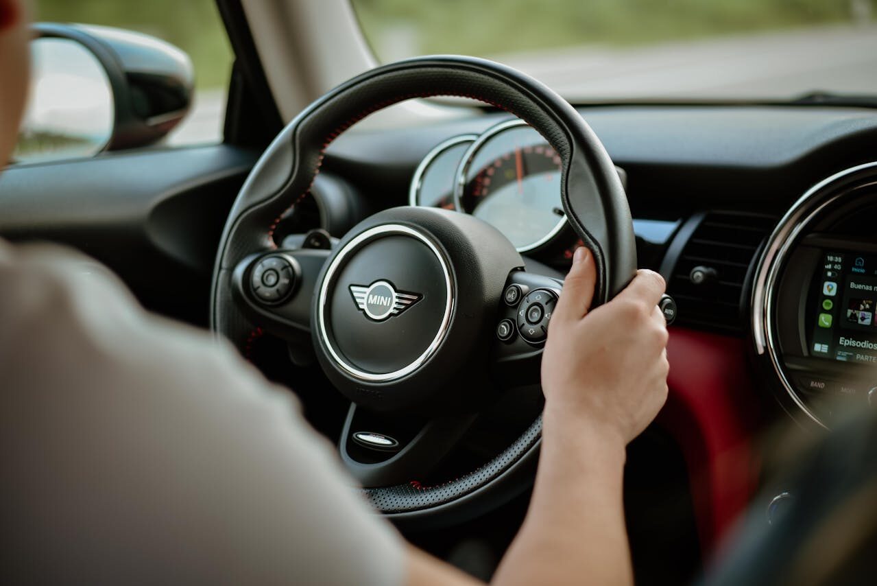 Man Driving a Mini Cooper